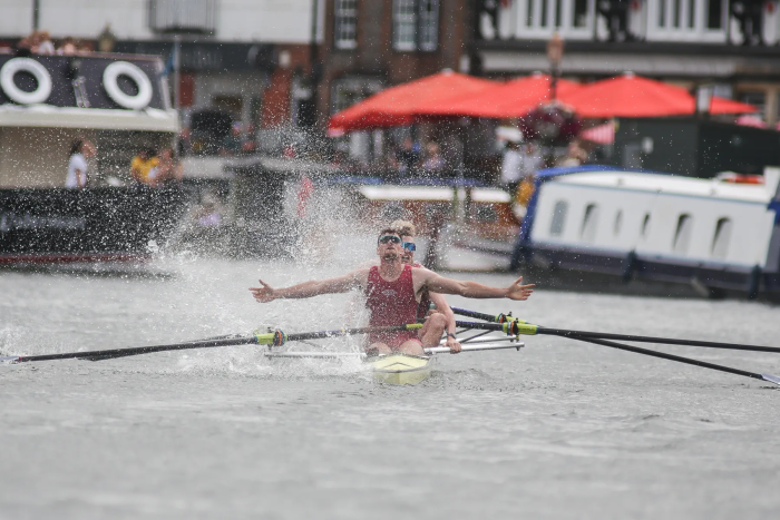 rowers celebrating their win on the water at Henley regatta